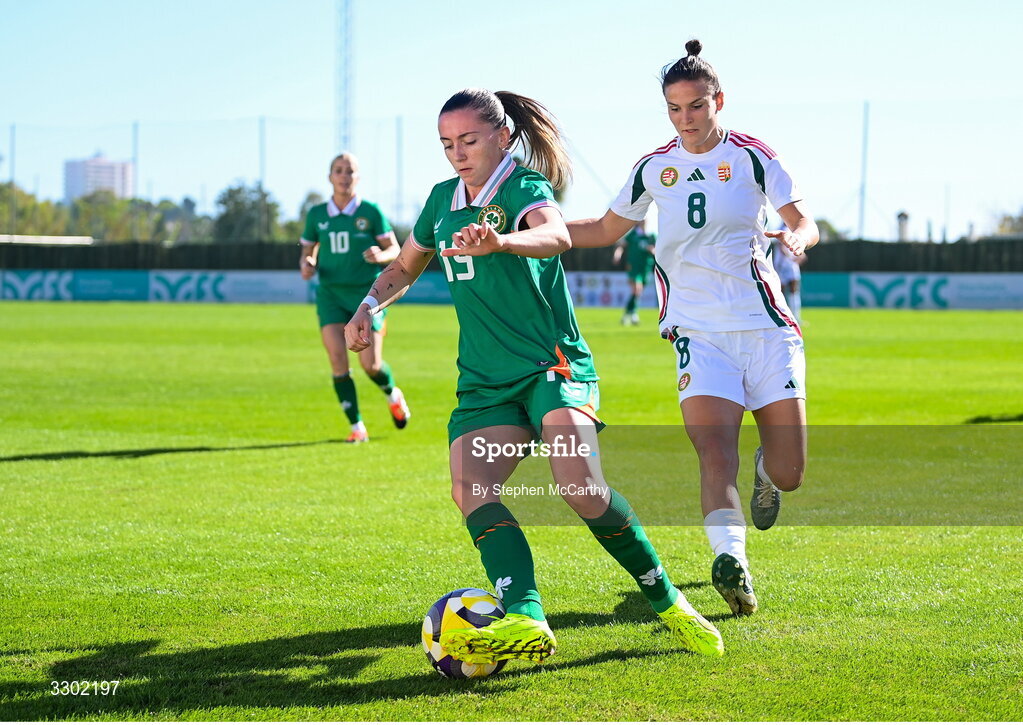 29 November 2025; Abbie Larkin of Republic of Ireland in action against Viktoria Szabo of Hungary during the women's international friendly match between Republic of Ireland and Hungary at Marbella Football Centre in Marbella, Spain. Photo by Stephen McCarthy/Sportsfile