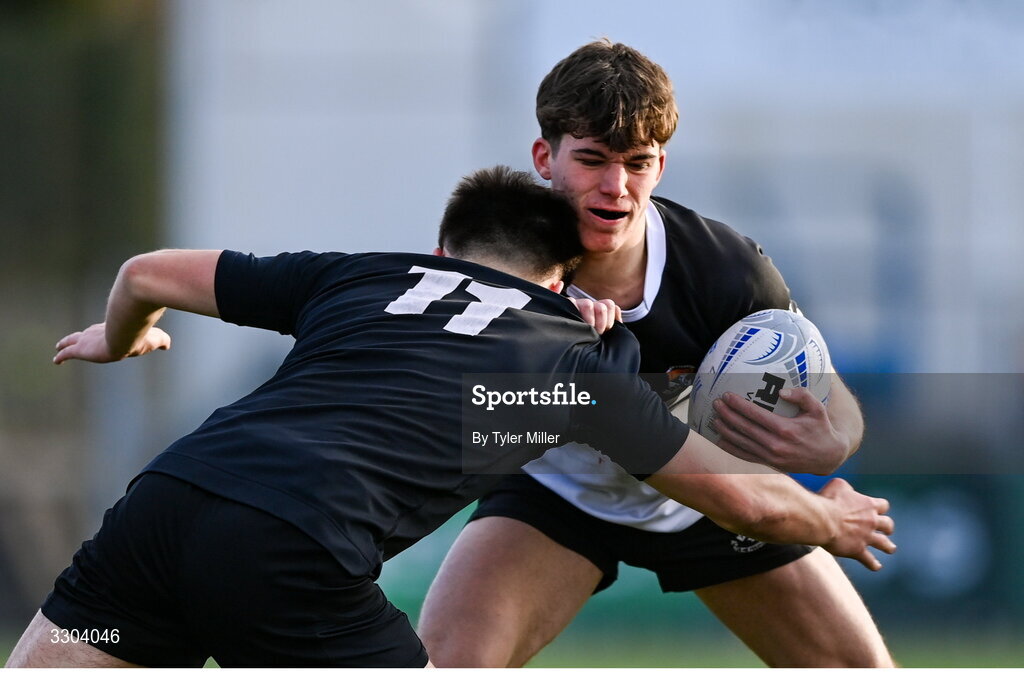 3 December 2025; Achille Crasto of Newbridge College in action against Sean Stone of Cistercian College Roscrea during the Bank of Ireland Leinster Rugby Schools Senior League Division 1A semi-final match between Cistercian College Roscrea and Newbridge College at Energia Park in Dublin. Photo by Tyler Miller/Sportsfile