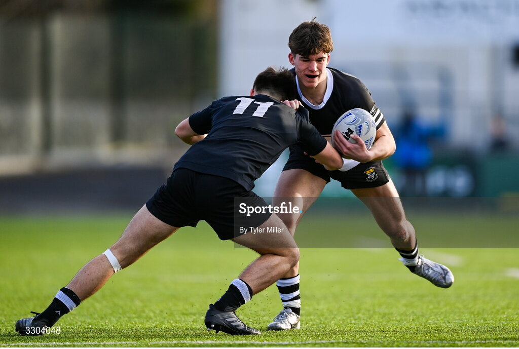 3 December 2025; Achille Crasto of Newbridge College in action against Sean Stone of Cistercian College Roscrea during the Bank of Ireland Leinster Rugby Schools Senior League Division 1A semi-final match between Cistercian College Roscrea and Newbridge College at Energia Park in Dublin. Photo by Tyler Miller/Sportsfile