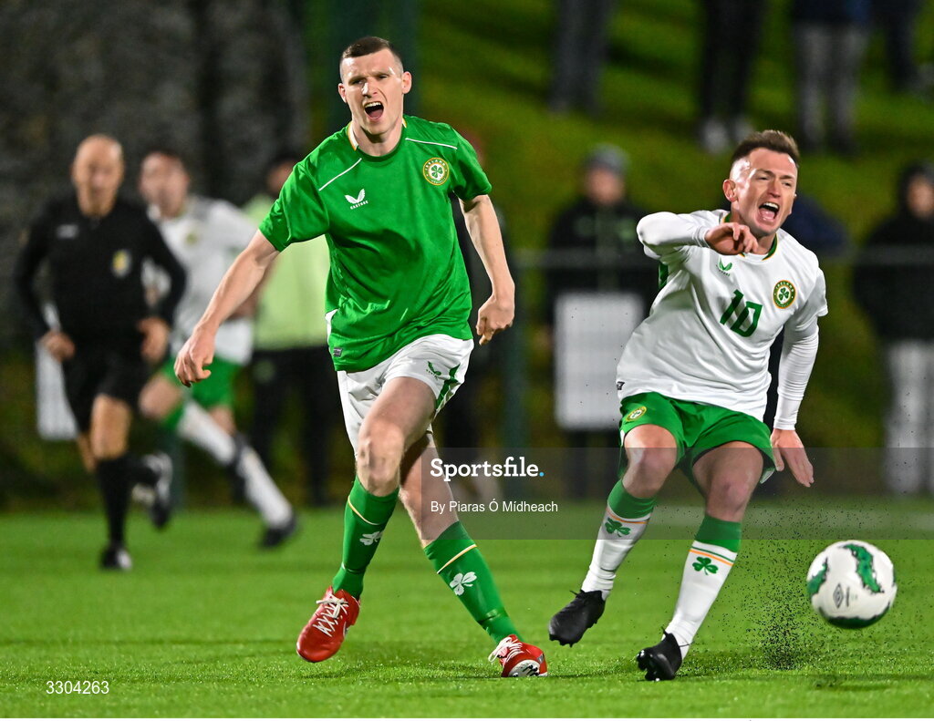 3 December 2025; Dean Walsh of Ireland Amateur and Adrian Rafferty of Irish Defence Forces, right, react after a tackle during the representative friendly match between Ireland Amateur and Irish Defence Forces at Wayside Celtic FC in Dublin. Photo by Piaras Ó Mídheach/Sportsfile