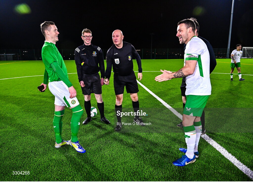 3 December 2025; Referee Paul Tuite with team captains Jimmy Carr of Ireland Amateur, left, and Aidan Friel of Irish Defence Forces for the coin toss before the representative friendly match between Ireland Amateur and Irish Defence Forces at Wayside Celtic FC in Dublin. Photo by Piaras Ó Mídheach/Sportsfile