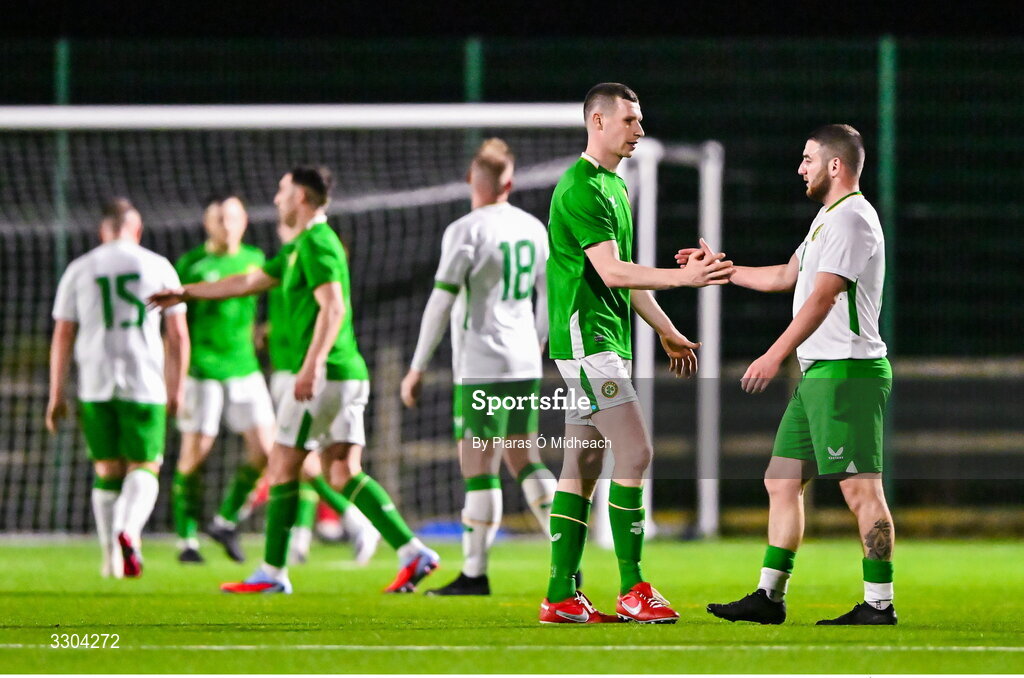 3 December 2025; Dean Walsh of Ireland Amateur and Brandon Daly of Irish Defence Forces, right, after the representative friendly match between Ireland Amateur and Irish Defence Forces at Wayside Celtic FC in Dublin. Photo by Piaras Ó Mídheach/Sportsfile