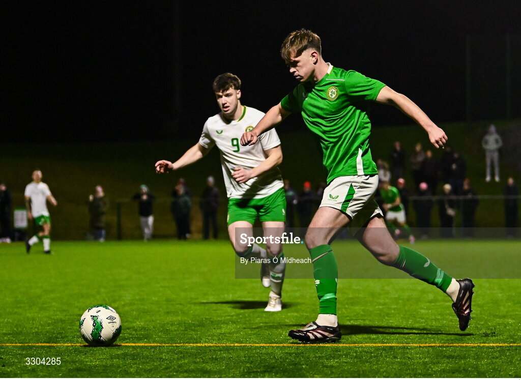 3 December 2025; Harvey Cullinan of Ireland Amateur in action against Ronan Kierns of Irish Defence Forces, 9, during the representative friendly match between Ireland Amateur and Irish Defence Forces at Wayside Celtic FC in Dublin. Photo by Piaras Ó Mídheach/Sportsfile