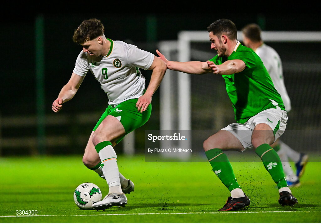 3 December 2025; Ronan Kierns of Irish Defence Forces, left, in action against Tony Whitehead of Ireland Amateur during the representative friendly match between Ireland Amateur and Irish Defence Forces at Wayside Celtic FC in Dublin. Photo by Piaras Ó Mídheach/Sportsfile
