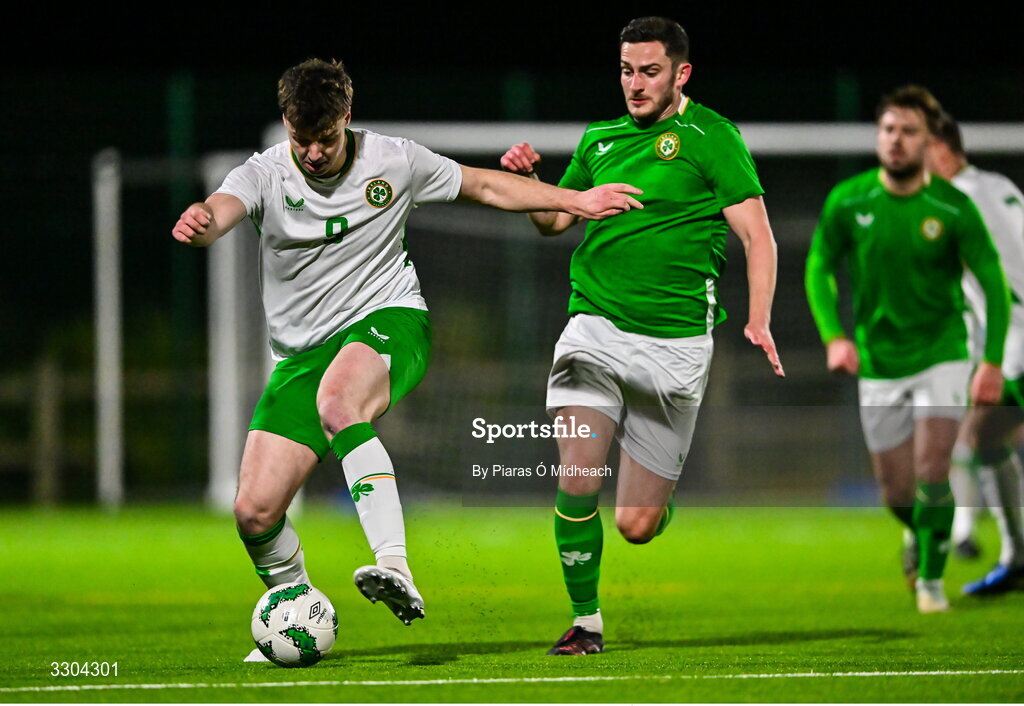 3 December 2025; Ronan Kierns of Irish Defence Forces, left, in action against Tony Whitehead of Ireland Amateur during the representative friendly match between Ireland Amateur and Irish Defence Forces at Wayside Celtic FC in Dublin. Photo by Piaras Ó Mídheach/Sportsfile