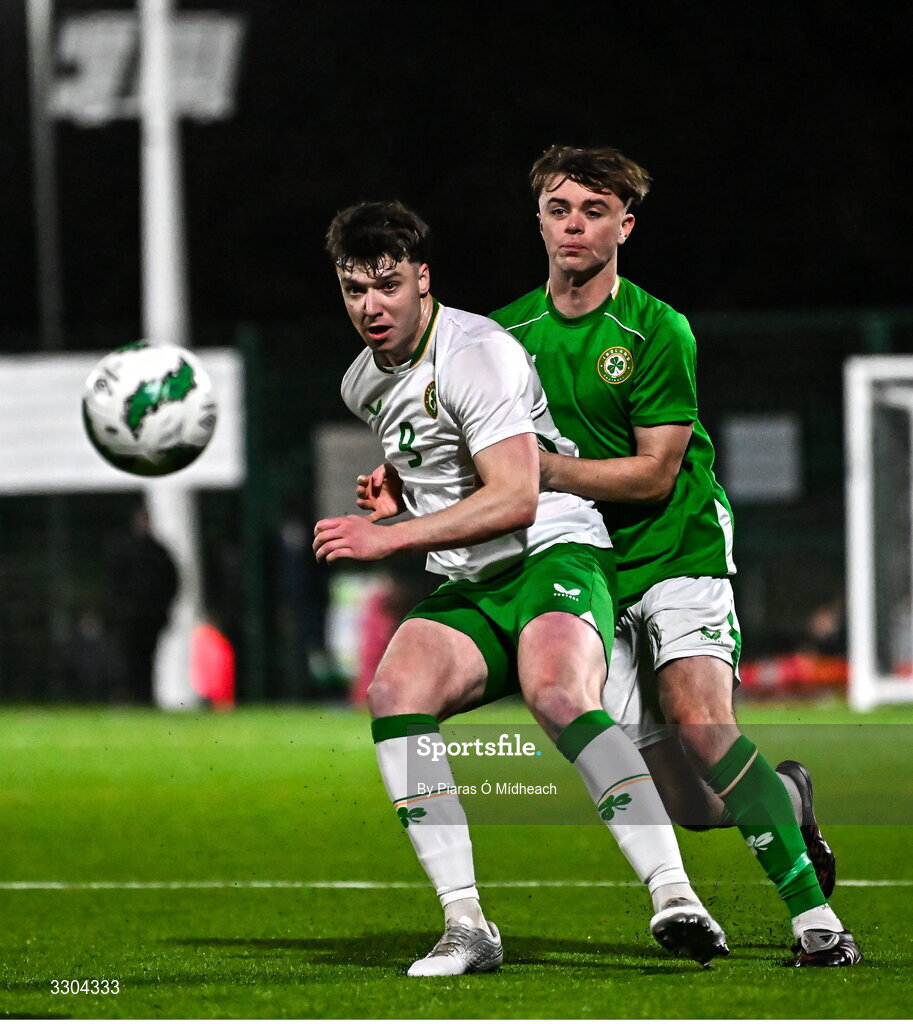 3 December 2025; Ronan Kierns of Irish Defence Forces, front, in action against Harvey Cullinan of Ireland Amateur during the representative friendly match between Ireland Amateur and Irish Defence Forces at Wayside Celtic FC in Dublin. Photo by Piaras Ó Mídheach/Sportsfile