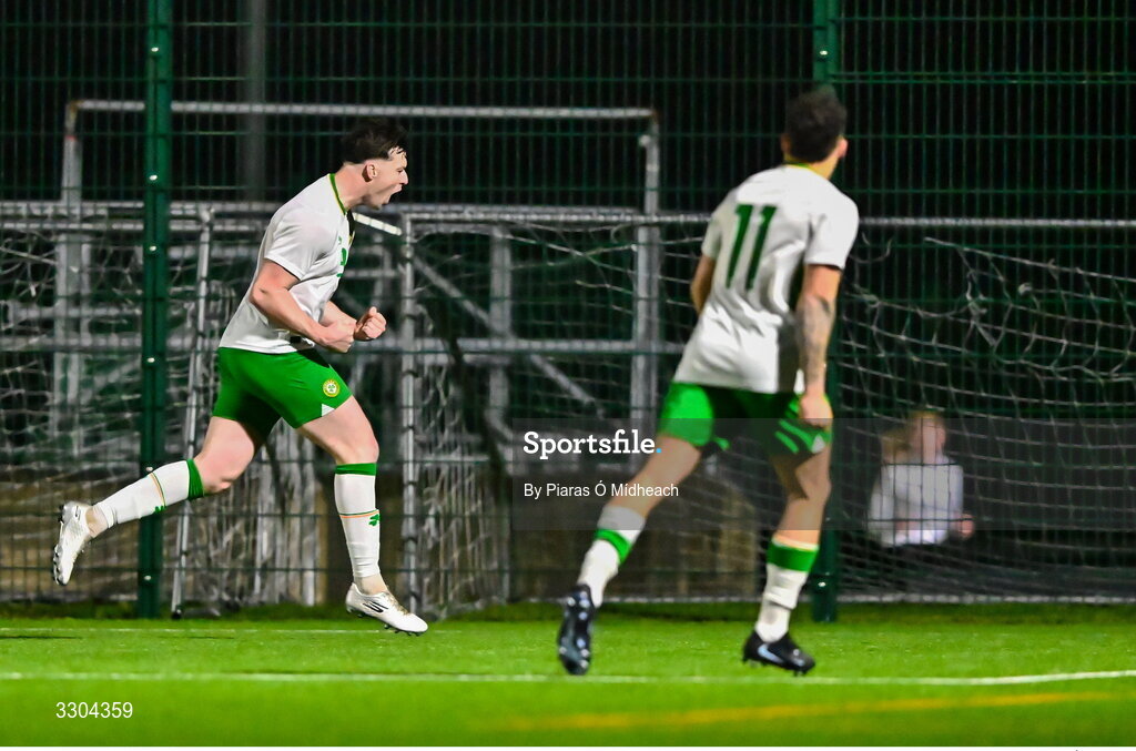 3 December 2025; Ronan Kierns of Irish Defence Forces, left, celebrates scoring his side's second goal during the representative friendly match between Ireland Amateur and Irish Defence Forces at Wayside Celtic FC in Dublin. Photo by Piaras Ó Mídheach/Sportsfile