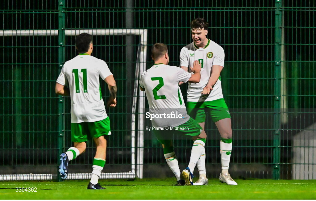 3 December 2025; Ronan Kierns of Irish Defence Forces celebrates with team-mates Callum Lynch, 11, and Aidan Friel, 2, after scoring their side's second goal during the representative friendly match between Ireland Amateur and Irish Defence Forces at Wayside Celtic FC in Dublin. Photo by Piaras Ó Mídheach/Sportsfile