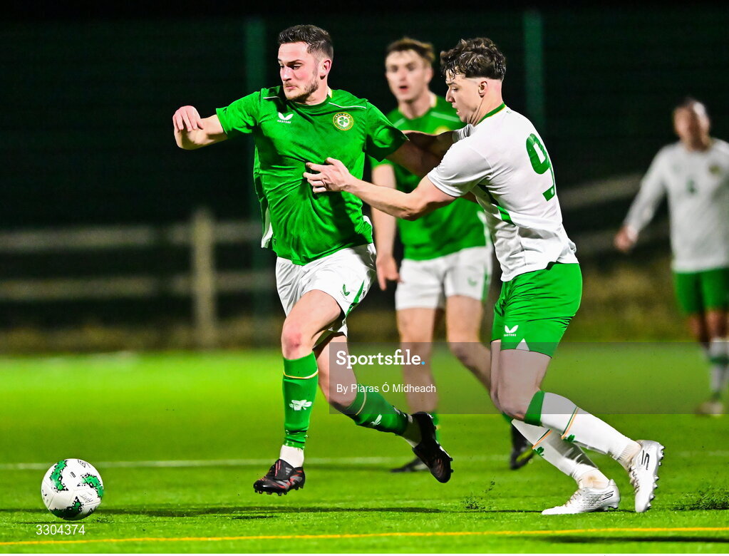 3 December 2025; Tony Whitehead of Ireland Amateur in action against Ronan Kierns of Irish Defence Forces, 9, during the representative friendly match between Ireland Amateur and Irish Defence Forces at Wayside Celtic FC in Dublin. Photo by Piaras Ó Mídheach/Sportsfile