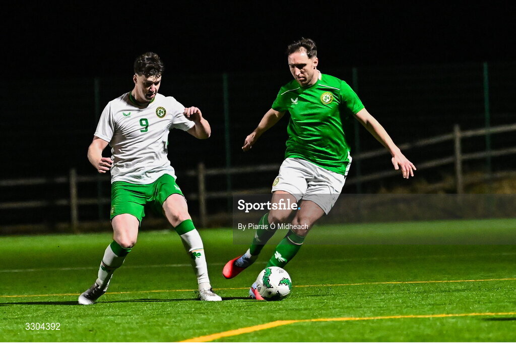 3 December 2025; Conor Whittle of Ireland Amateur, right, in action against Ronan Kierns of Irish Defence Forces during the representative friendly match between Ireland Amateur and Irish Defence Forces at Wayside Celtic FC in Dublin. Photo by Piaras Ó Mídheach/Sportsfile