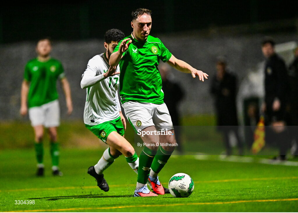 3 December 2025; Conor Whittle of Ireland Amateur, front, in action against Mo Alharti of Irish Defence Forces during the representative friendly match between Ireland Amateur and Irish Defence Forces at Wayside Celtic FC in Dublin. Photo by Piaras Ó Mídheach/Sportsfile