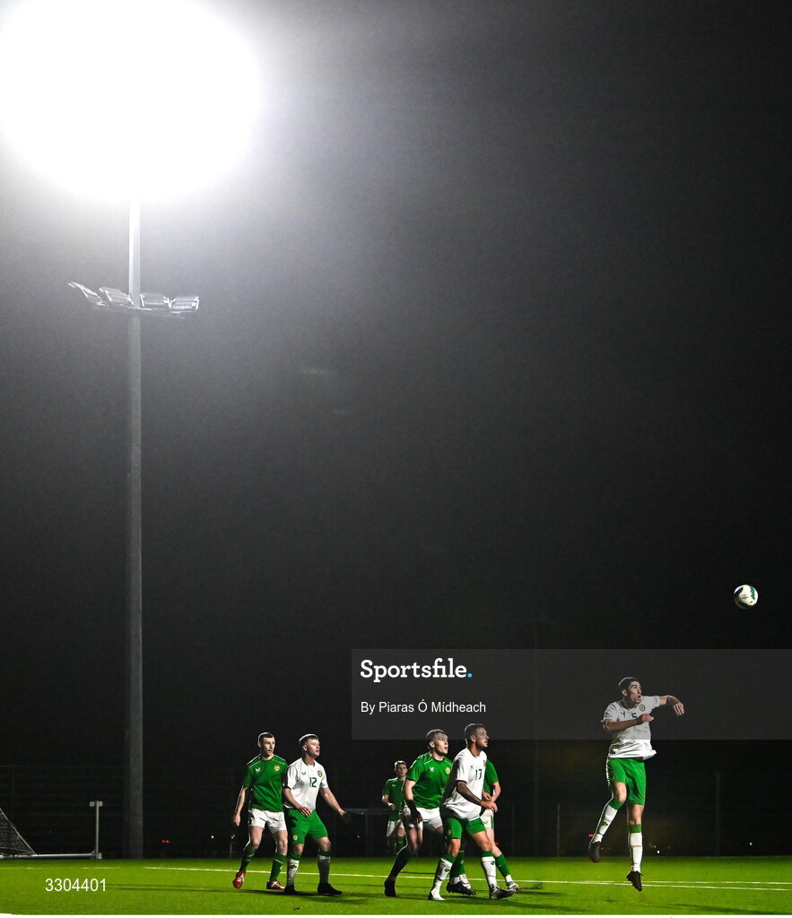 3 December 2025; Joe Manly of Irish Defence Forces wins a header during the representative friendly match between Ireland Amateur and Irish Defence Forces at Wayside Celtic FC in Dublin. Photo by Piaras Ó Mídheach/Sportsfile