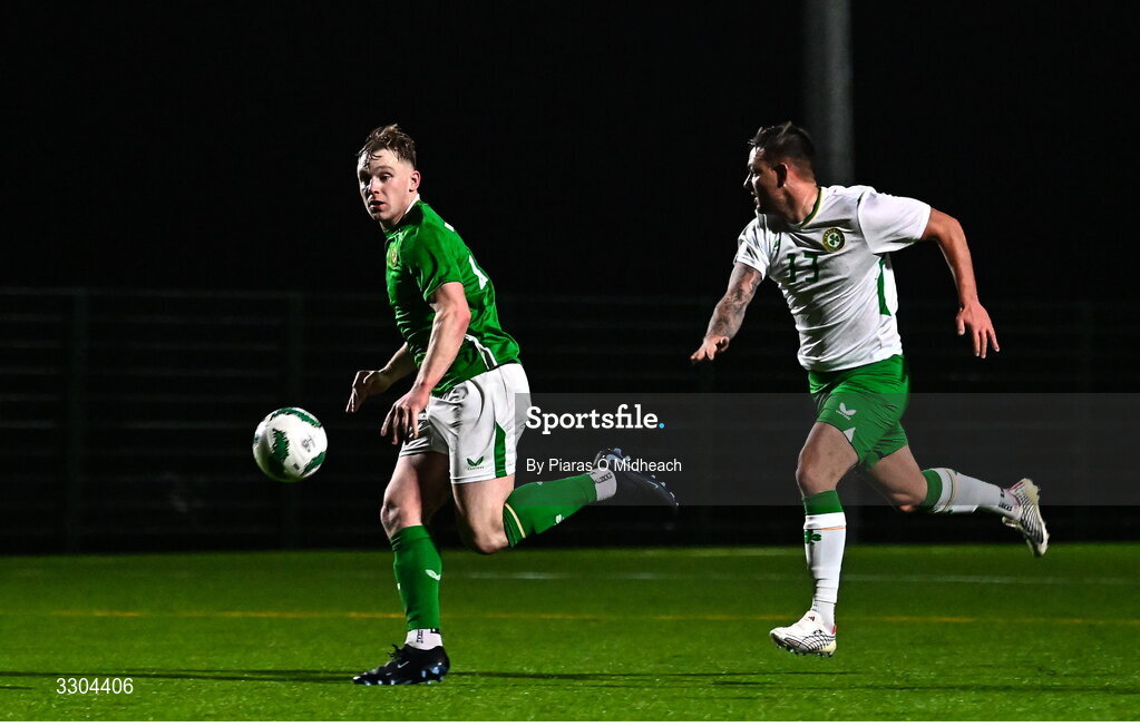 3 December 2025; Ed O’Dwyer of Ireland Amateur, left, in action against Ger Hayes of Irish Defence Forces during the representative friendly match between Ireland Amateur and Irish Defence Forces at Wayside Celtic FC in Dublin. Photo by Piaras Ó Mídheach/Sportsfile