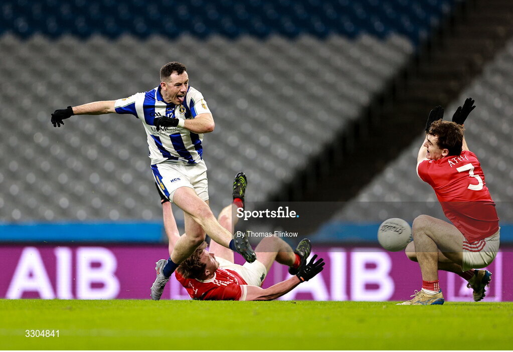 6 December 2025; Ryan Basquel of Ballyboden St Enda’s on his way to scoring his side's first goal despite the efforts of Michael Spillane, right, and Darren Lawler of Athy during the AIB Leinster GAA Football Senior Club Championship final match between Athy of Kildare and Ballyboden St Enda's of Dublin at Croke Park in Dublin. Photo by Thomas Flinkow/Sportsfile