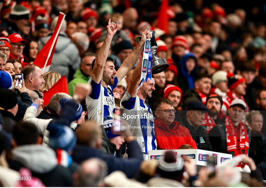 6 December 2025; Ballyboden St Enda's captain Shane Clayton, left, and vice-captain James Holland lift the Seán McCabe Cup after their side's victory the AIB Leinster GAA Football Senior Club Championship final match between Athy of Kildare and Ballyboden St Enda's of Dublin at Croke Park in Dublin. Photo by Thomas Flinkow/Sportsfile