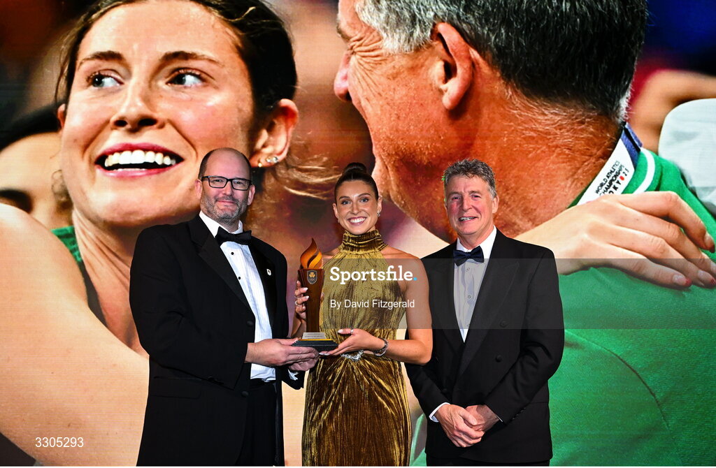 6 December 2025; World Silver Medallist in Heptathlon Kate O'Connor, and her father and coach Michael O'Connor are presented with the Olympic Sporting Moment of the Year Award, Sponsored by Fiat, by John Saunders, Managing Director of Fiat Ireland during the Team Ireland Olympic Sport Awards 2025 at The Royal Convention Centre in Dublin. Photo by David Fitzgerald/Sportsfile