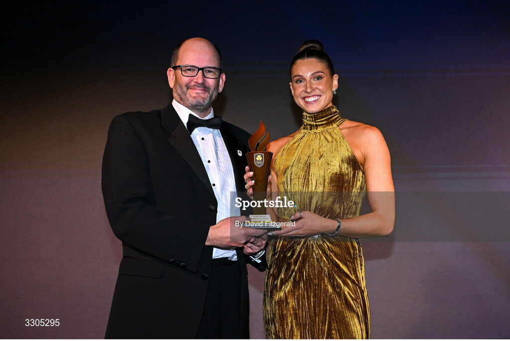 6 December 2025; World Silver Medallist in Heptathlon Kate O'Connor is presented with the Olympic Sporting Moment of the Year Award, Sponsored by Fiat, by John Saunders, Managing Director of Fiat Ireland during the Team Ireland Olympic Sport Awards 2025 at The Royal Convention Centre in Dublin. Photo by David Fitzgerald/Sportsfile