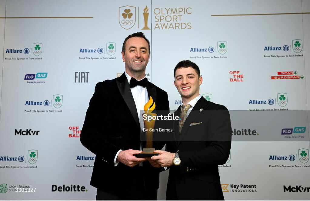 6 December 2025; Olympic Champion in Gymnastics Rhys McClenaghan, right, is presented with the Creator of the Year Award, sponsored by McKeever Sports, by Padraic McKeever, Managing Director of McKeever Sports during the Team Ireland Olympic Sport Awards 2025 at The Royal Convention Centre in Dublin. Photo by Sam Barnes/Sportsfile