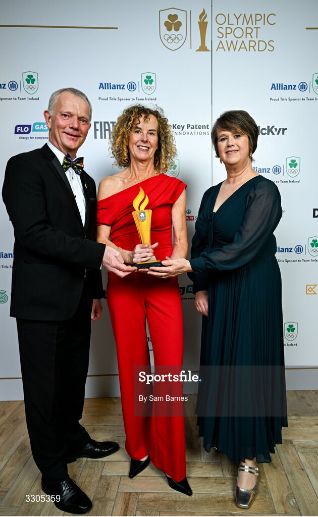 6 December 2025; Inbhear Dee Athletics Club’s  Eithne Walsh, centre, & Anne-Marie Kelly, right, are presented with the Community Impact Award, sponsored by SPAR/EUROSPAR, by John Moane, Group Chief Executive, BWG Group during the Team Ireland Olympic Sport Awards 2025 at The Royal Convention Centre in Dublin. Photo by Sam Barnes/Sportsfile