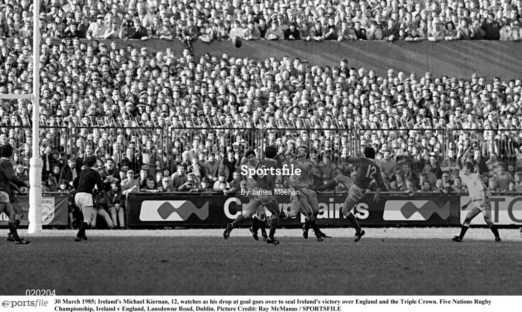 30 March 1985; Ireland's Michael Kiernan, 12, watches as his drop at goal goes over to seal Ireland's victory over England and the Triple Crown. Five Nations Rugby Championship, Ireland v England, Lansdowne Road, Dublin. Picture credit: James Meehan / SPORTSFILE