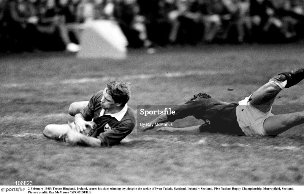 2 February 1985; Trevor Ringland of Ireland scores his sides winning try, despite the tackle of Iwan Tukalo of Scotland during the Five Nations Championship match between Scotland and Ireland at Murrayfield in Edinburgh, Scotland. Photo by Ray McManus/Sportsfile