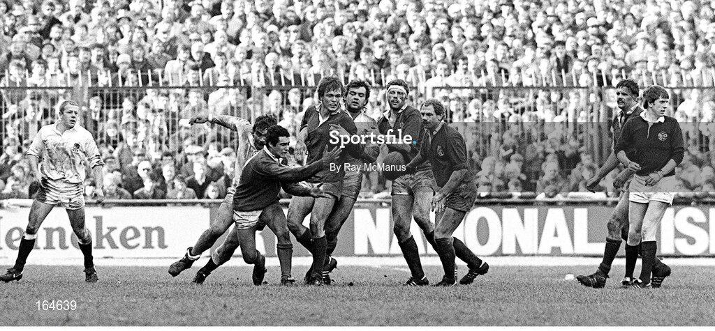 30 March 1985; Ireland scrum-half Michael Bradley gets the ball away, watched by, from left, Richard Hill and Robert Hesford, both England, Brian Spillane, Ireland, John Orwin, England, Philip Matthews, Nigel Carr, and Willie Anderson, Ireland, and Jim Fleming, Referee. Five Nations Rugby Championship, Ireland v England, Lansdowne Road, Dublin. Picture credit: Ray McManus / SPORTSFILE