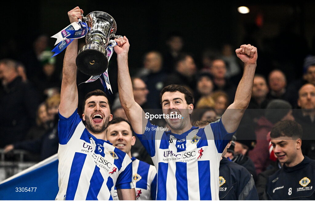 6 December 2025; Ballyboden St Enda's players Alex Gavin, left, and James Madden lift the Seán McCabe Cup after their side's victory in the AIB Leinster GAA Football Senior Club Championship final match between Athy of Kildare and Ballyboden St Enda's  of Dublin at Croke Park in Dublin. Photo by Seb Daly/Sportsfile