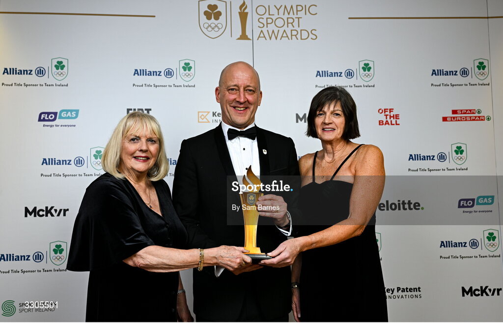 6 December 2025; Shauna Kyle, representing her mother Maeve Kyle, left, and Carolyn Burns, goddaughter of Maeve Kyle, right, are presented with the President's Award, by Lochlann Walsh, President of Olympic Federation of Ireland during the Team Ireland Olympic Sport Awards 2025 at The Royal Convention Centre in Dublin. Photo by Sam Barnes/Sportsfile