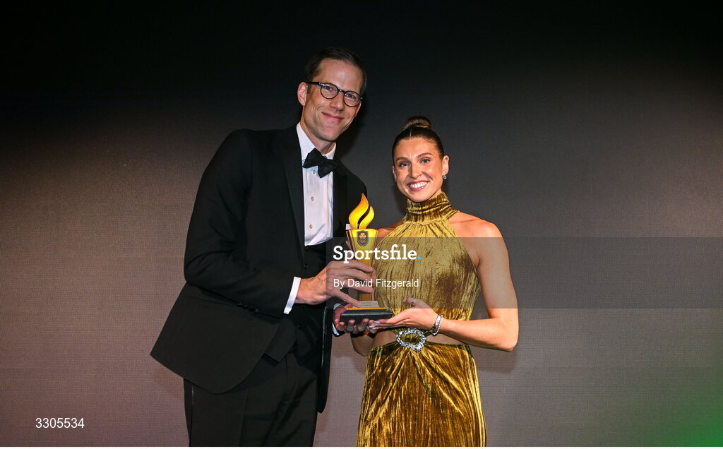 6 December 2025; World Silver Medallist in Heptathlon Kate O'Connor is presented with the Female Athlete of the Year Award, sponsored by Allianz, by Phillip Gronemeyer, Chief Executive of Allianz Ireland, during the Team Ireland Olympic Sport Awards 2025 at The Royal Convention Centre in Dublin. Photo by David Fitzgerald/Sportsfile