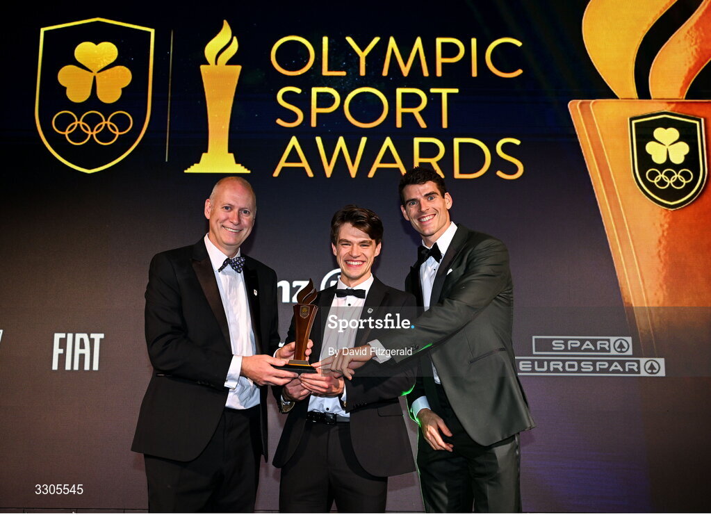 6 December 2025; World Bronze Medallists in Rowing, Fintan McCarthy, centre, and Philip Doyle, right, are presented with the Team of the Year Award, sponsored by Flogas, by John Rooney, Managing Director at Flogas, during the Team Ireland Olympic Sport Awards 2025 at The Royal Convention Centre in Dublin. Photo by David Fitzgerald/Sportsfile