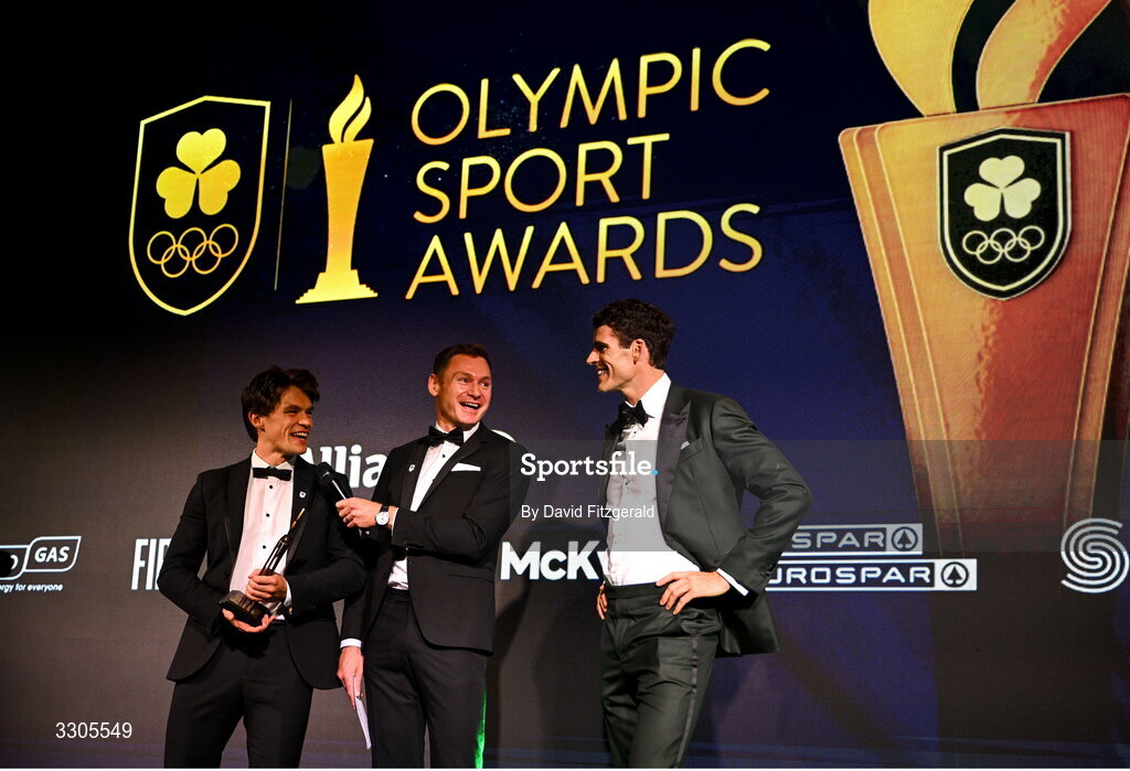 6 December 2025; World Bronze Medallists in Rowing, Fintan McCarthy, left, and Philip Doyle, right, are interviewed by MC David Gillick as they collect their Team of the Year Award, sponsored by Flogas, during the Team Ireland Olympic Sport Awards 2025 at The Royal Convention Centre in Dublin. Photo by David Fitzgerald/Sportsfile