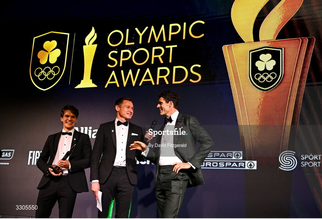 6 December 2025; World Bronze Medallists in Rowing, Fintan McCarthy, left, and Philip Doyle, right, are interviewed by MC David Gillick as they collect their Team of the Year Award, sponsored by Flogas, during the Team Ireland Olympic Sport Awards 2025 at The Royal Convention Centre in Dublin. Photo by David Fitzgerald/Sportsfile