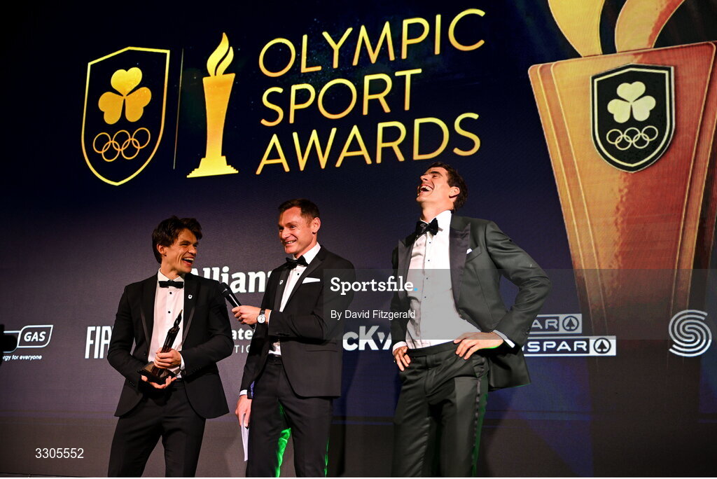 6 December 2025; World Bronze Medallists in Rowing, Fintan McCarthy, left, and Philip Doyle, right, are interviewed by MC David Gillick as they collect their Team of the Year Award, sponsored by Flogas, during the Team Ireland Olympic Sport Awards 2025 at The Royal Convention Centre in Dublin. Photo by David Fitzgerald/Sportsfile