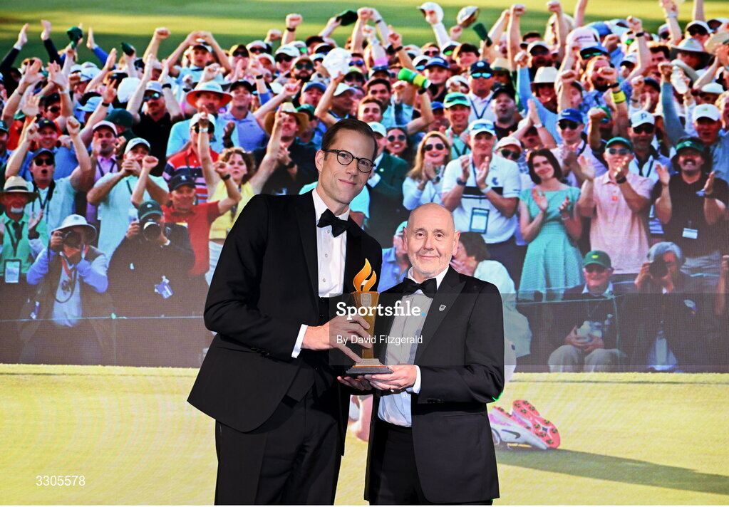 6 December 2025; Brian McIlroy, representing his nephew Rory McIlroy, right, is presented with the Male Athlete of the Year Award, sponsored by Allianz, by Phillip Gronemeyer, Chief Executive of Allianz Ireland during the Team Ireland Olympic Sport Awards 2025 at The Royal Convention Centre in Dublin. Photo by David Fitzgerald/Sportsfile