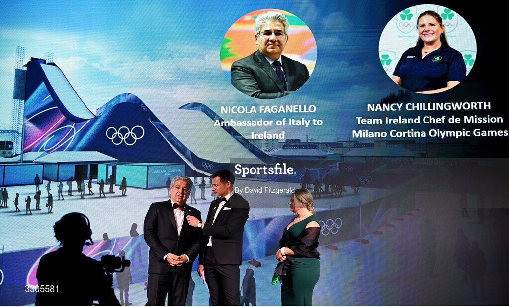 6 December 2025; Ambassador of Italy to Ireland, Nicola Faganello, left, and Team Ireland Chef de Mission for Milano Cortina 2026, Nancy Chillingworth, right, are interviewed by MC David Gillick, during the Team Ireland Olympic Sport Awards 2025 at The Royal Convention Centre in Dublin. Photo by David Fitzgerald/Sportsfile