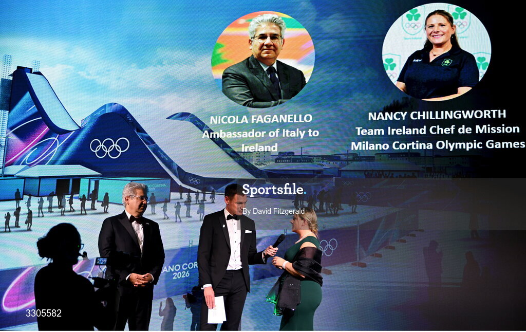 6 December 2025; Ambassador of Italy to Ireland, Nicola Faganello, left, and Team Ireland Chef de Mission for Milano Cortina 2026, Nancy Chillingworth, right, are interviewed by MC David Gillick, during the Team Ireland Olympic Sport Awards 2025 at The Royal Convention Centre in Dublin. Photo by David Fitzgerald/Sportsfile
