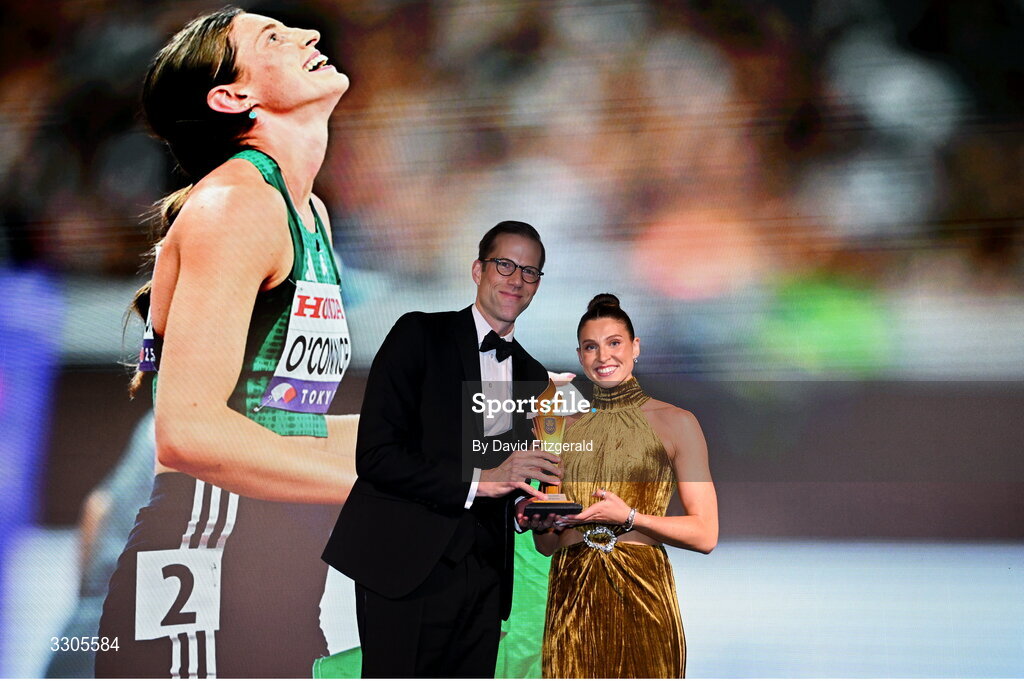 6 December 2025; World Silver Medallist in Heptathlon Kate O'Connor is presented with the Female Athlete of the Year Award, sponsored by Allianz, by Phillip Gronemeyer, Chief Executive of Allianz Ireland, during the Team Ireland Olympic Sport Awards 2025 at The Royal Convention Centre in Dublin. Photo by David Fitzgerald/Sportsfile