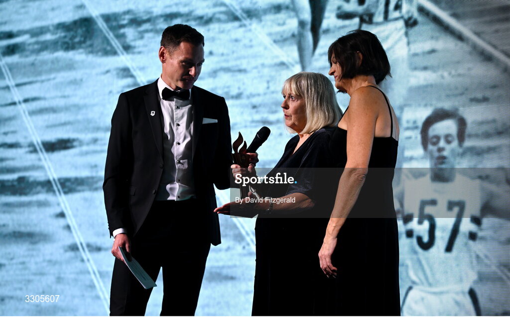6 December 2025; Shauna Kyle, centre, representing her mother Maeve Kyle, and Carolyn Burns, right, goddaughter of Maeve Kyle, are interviewed by MC David Gillick, after collecting the President's Award during the Team Ireland Olympic Sport Awards 2025 at The Royal Convention Centre in Dublin. Photo by David Fitzgerald/Sportsfile