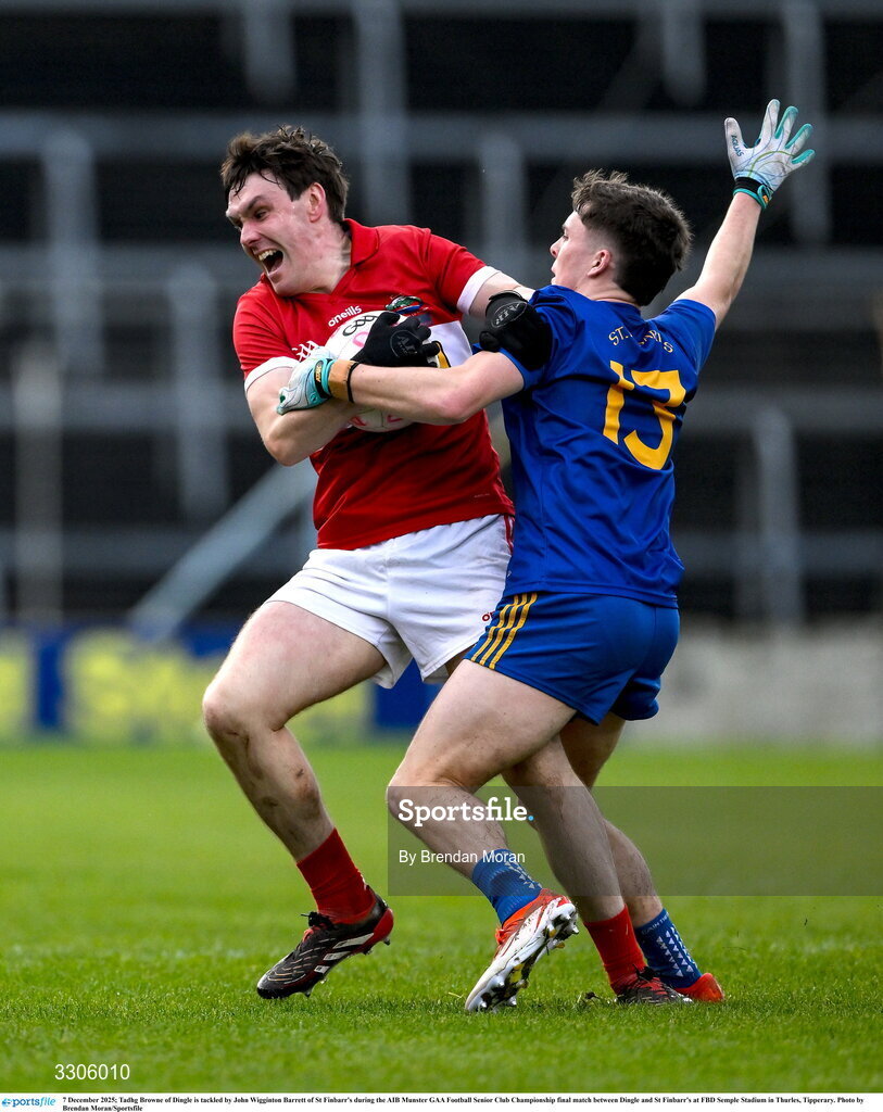 7 December 2025; Tadhg Browne of Dingle is tackled by John Wigginton Barrett of St Finbarr's during the AIB Munster GAA Football Senior Club Championship final match between Dingle and St Finbarr's at FBD Semple Stadium in Thurles, Tipperary. Photo by Brendan Moran/Sportsfile