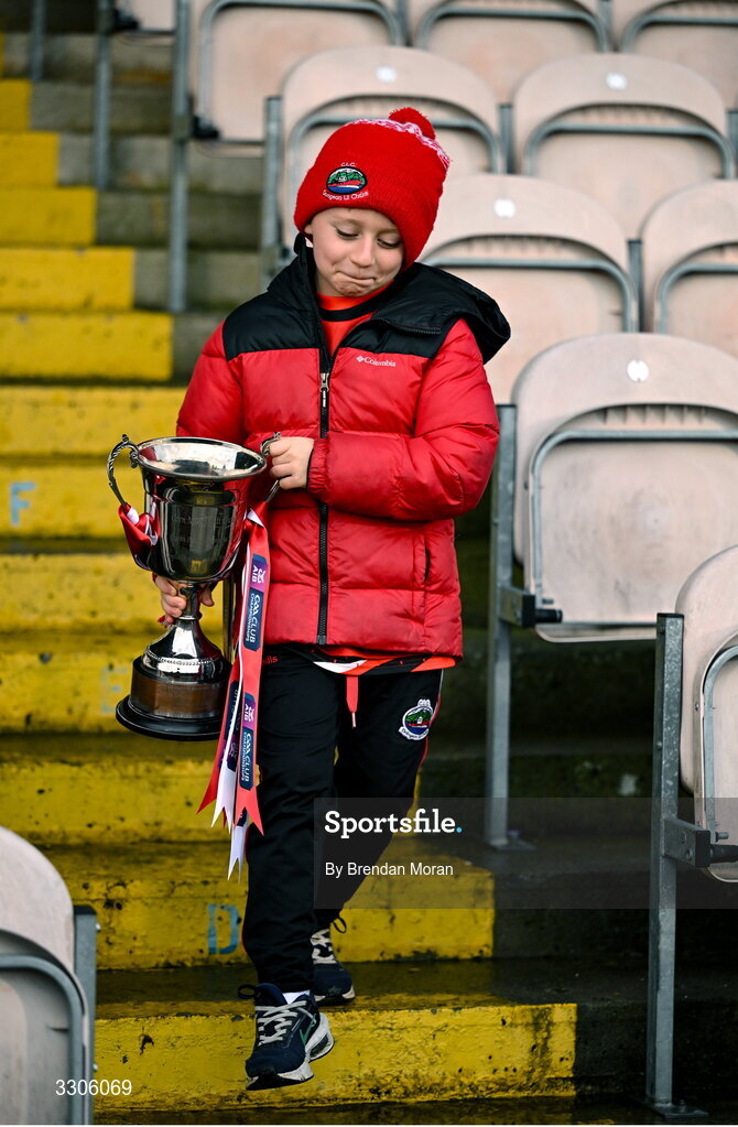7 December 2025; Páidí Geaney, son of Dingle captain Paul Geaney, carries the cup after the AIB Munster GAA Football Senior Club Championship final match between Dingle and St Finbarr's at FBD Semple Stadium in Thurles, Tipperary. Photo by Brendan Moran/Sportsfile