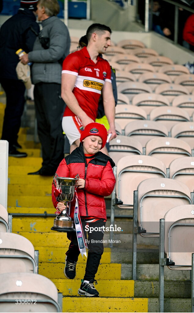 7 December 2025; Páidí Geaney, son of Dingle captain Paul Geaney, carries the cup after the AIB Munster GAA Football Senior Club Championship final match between Dingle and St Finbarr's at FBD Semple Stadium in Thurles, Tipperary. Photo by Brendan Moran/Sportsfile