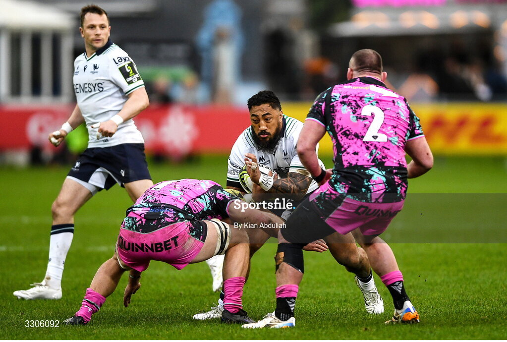 7 December 2025; Bundee Aki of Connacht is tackled by Sam Parry of Ospreys during the EPCR Challenge Cup match between Ospreys and Connacht at Dunraven Brewery Field in Bridgend, Wales. Photo by Kian Abdullah/Sportsfie