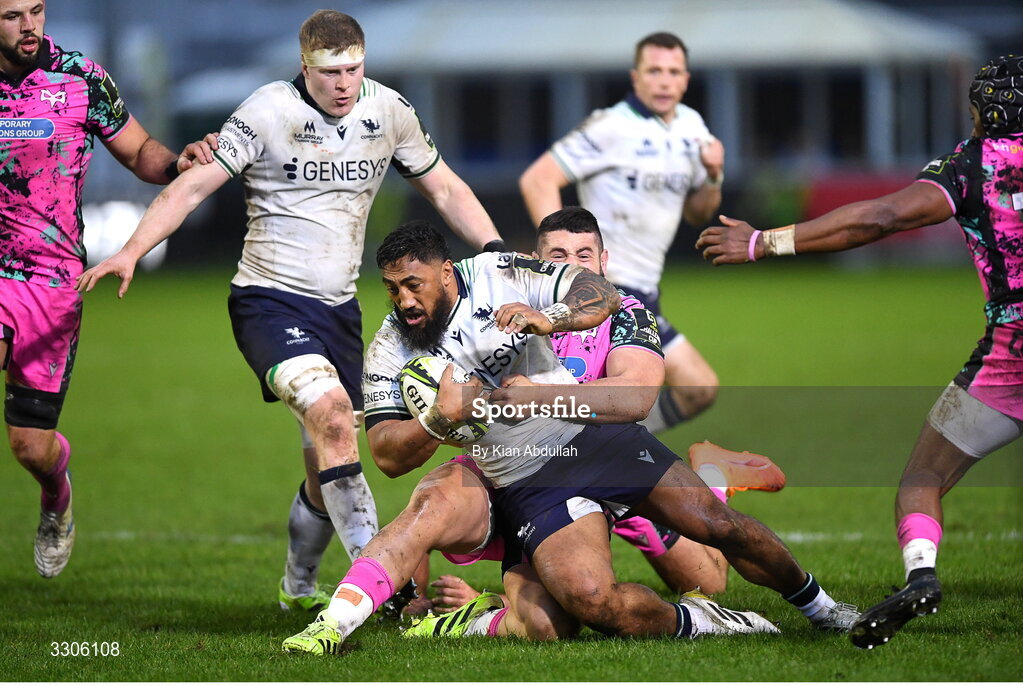 7 December 2025; Bundee Aki of Connacht is challenged by Gareth Thomas of Ospreys during the EPCR Challenge Cup match between Ospreys and Connacht at Dunraven Brewery Field in Bridgend, Wales. Photo by Kian Abdullah/Sportsfie