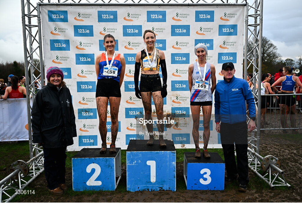 7 December 2025; Novice Women 4000m medalists, from second from left, Stephanie Cotter of West Muskerry AC, Cork, silver, Dearbhla Cox of Annadale Striders, Antrim, gold, centre, and Alex Murphy of Dundrum South Dublin AC, Dublin, second from right, with Athletics Ireland President Brid Golden, left, and Chief Executive Officer at Intact Insurance Ireland Kevin Thompson, after the Novice Women 4000m during the 123.ie National Novice and Juvenile Uneven Age Cross Country Championships at the Sport Ireland National Cross Country Track in Abbotstown, Dublin. Photo by Tyler Miller/Sportsfile