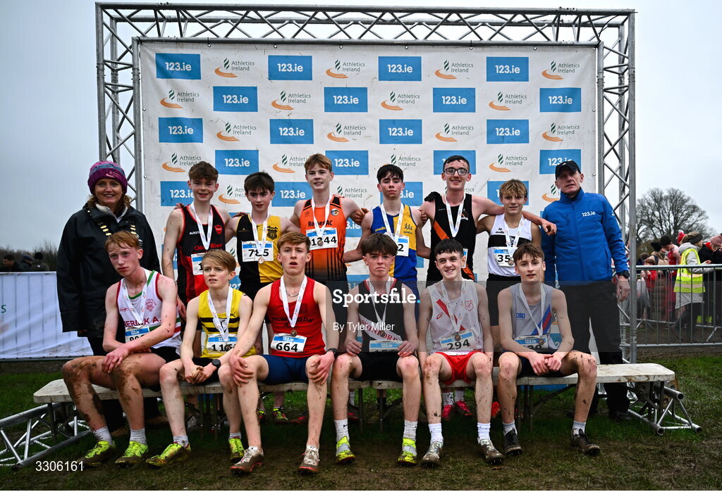 7 December 2025; U15 Boys 3500m top twelve with Athletics Ireland President Brid Golden, left, and Chief Executive Officer at Intact Insurance Ireland Kevin Thompson, right, during the 123.ie National Novice and Juvenile Uneven Age Cross Country Championships at the Sport Ireland National Cross Country Track in Abbotstown, Dublin. Photo by Tyler Miller/Sportsfile