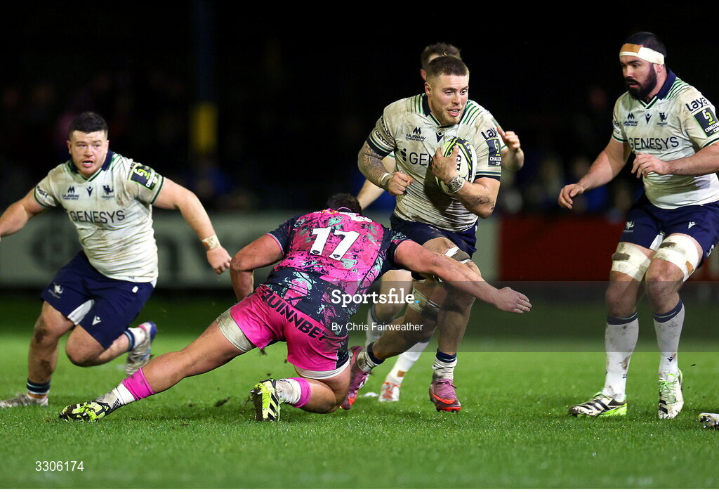 7 December 2025; Sean Jansen of Connacht is tackled by Gareth Thomas of Ospreys during the EPCR Challenge Cup match between Ospreys and Connacht at Dunraven Brewery Field in Bridgend, Wales. Photo by Chris Fairweather/Sportsfile