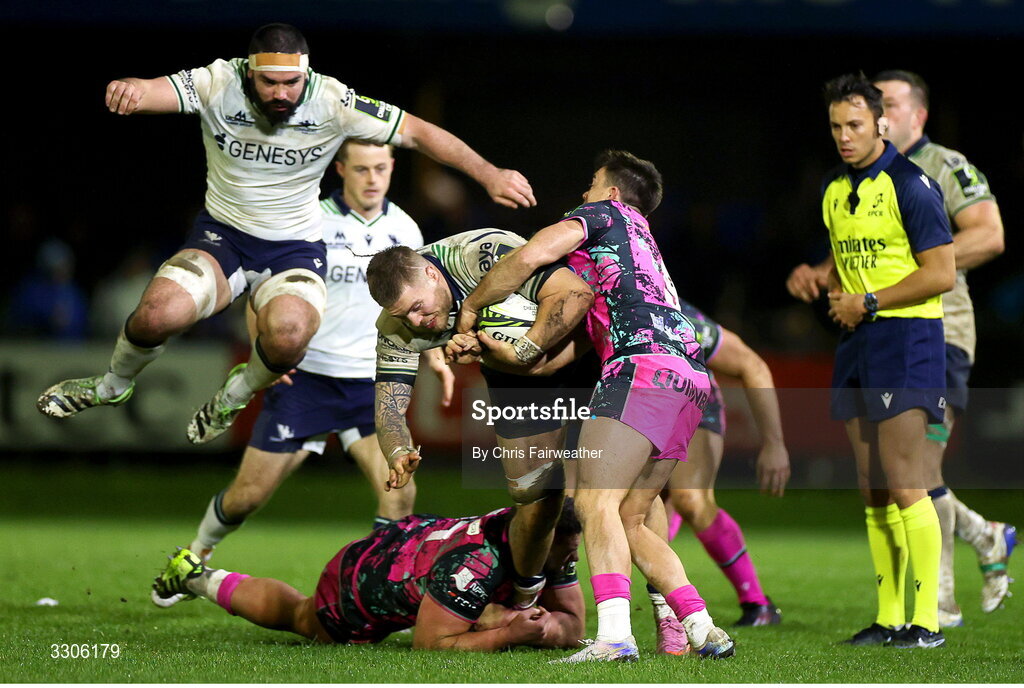 7 December 2025; Sean Jansen of Connacht is tackled by Gareth Thomas of Ospreys during the EPCR Challenge Cup match between Ospreys and Connacht at Dunraven Brewery Field in Bridgend, Wales. Photo by Chris Fairweather/Sportsfile