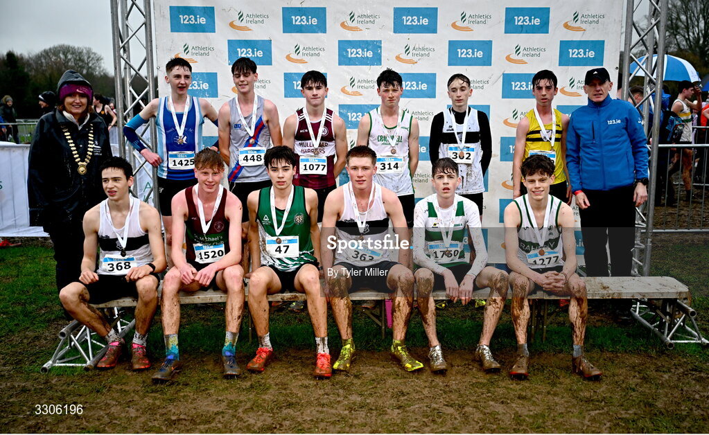 7 December 2025; U17 Boys 4500m top twelve with Athletics Ireland President Brid Golden, left, and Chief Executive Officer at Intact Insurance Ireland Kevin Thompson, right, during the 123.ie National Novice and Juvenile Uneven Age Cross Country Championships at the Sport Ireland National Cross Country Track in Abbotstown, Dublin. Photo by Tyler Miller/Sportsfile