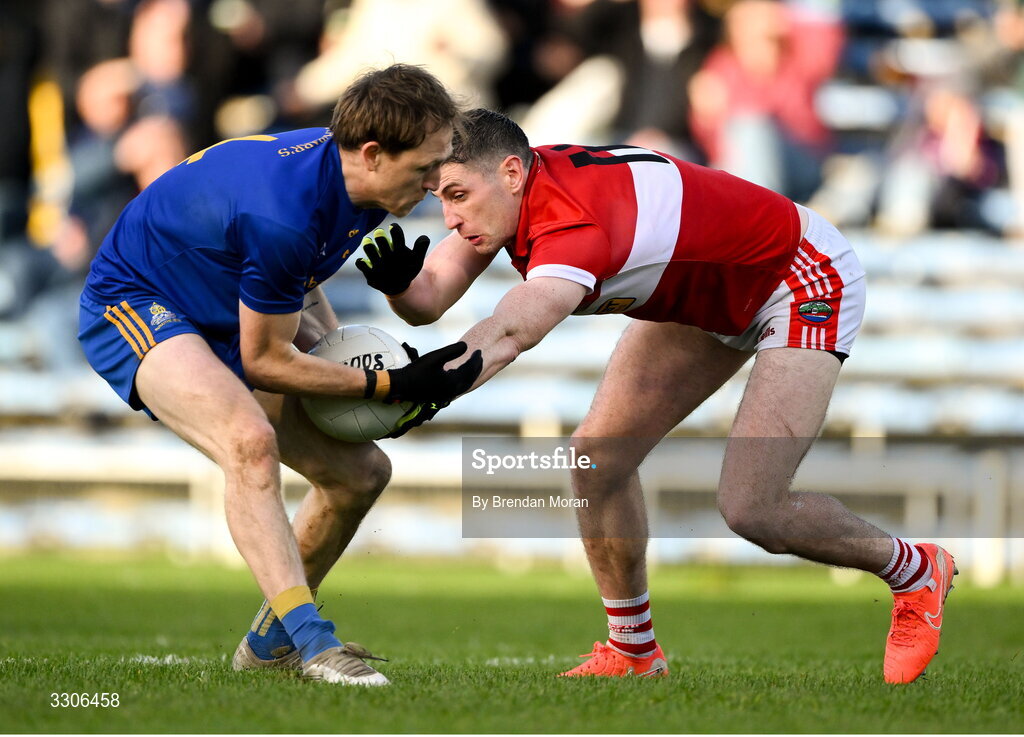 7 December 2025; Sam Ryan of St Finbarr's and Paul Geaney of Dingle contest a loose ball during the AIB Munster GAA Football Senior Club Championship final match between Dingle and St Finbarr's at FBD Semple Stadium in Thurles, Tipperary. Photo by Brendan Moran/Sportsfile