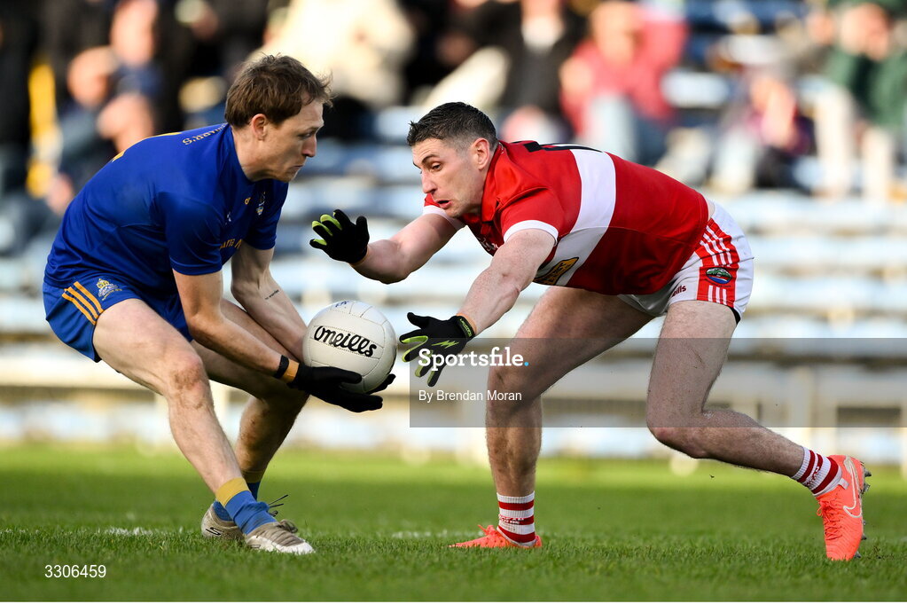 7 December 2025; Sam Ryan of St Finbarr's and Paul Geaney of Dingle contest a loose ball during the AIB Munster GAA Football Senior Club Championship final match between Dingle and St Finbarr's at FBD Semple Stadium in Thurles, Tipperary. Photo by Brendan Moran/Sportsfile